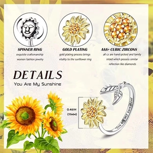 Detail of spinning sunflower ring with AAA+ zirconia and You are my sunshine engraving