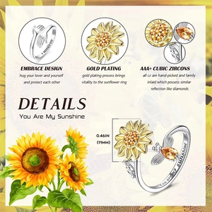 Detail of sunflower spinner ring with You Are My Sunshine engraving and cubic zirconia