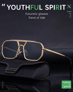 Close-up of vintage square gold metal sunglasses with dark lenses and leather case