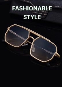 Detail of vintage aviator sunglasses with double bridge gold frame and gradient lenses