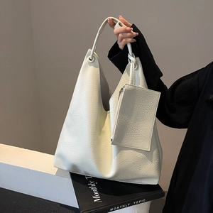 Large creamy white faux leather hobo tote bag with a small matching zipper pouch
