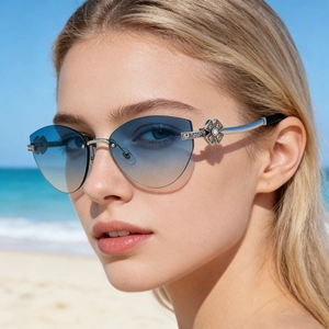Lunettes de soleil œil de chat sans monture avec verres dégradés bleus et branches à fleurs
