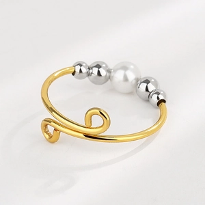 Adjustable wire-wrapped spinning anxiety ring with white pearl and silver beads in gold