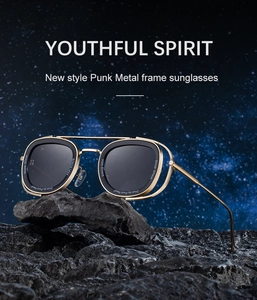 Detail view of steampunk metal sunglasses with side shields on volcanic rock backdrop