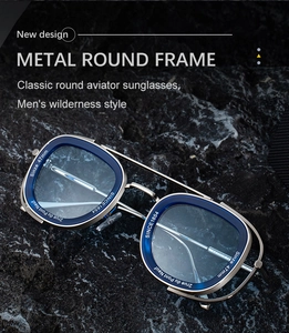 Detail of silver metal frame sunglasses with blue interior trim and engraved text