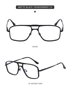 Detail view of matte black double-bridge rectangular glasses with clear lenses and slim metal temples