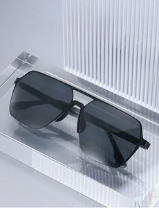 Detail view of square black polarized sunglasses with model 2517 on clear display stand