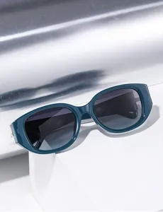 Detail of teal blue polarized sunglasses with specification code on the temple