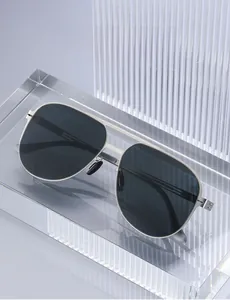 Close-up of polarized pilot sunglasses with silver metal frame on a display stand