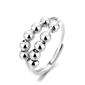 Polished silver fidget spinner ring with double rows of rotating beads for anxiety relief