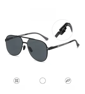 Detail of robust hinges and lightweight metal temples on black aviator sunglasses