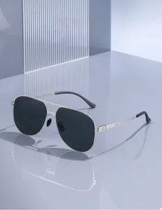 Close-up of classic aviator sunglasses featuring silver metal frames and polarized lenses