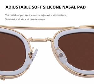 Macro view of adjustable metal support and soft silicone nose pads on oval sunglasses