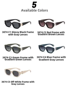 Detailed view of cat eye sunglasses with gold H-shaped metal hinges and colored frames
