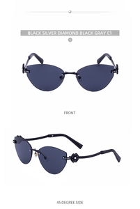 Détail de lunettes de soleil œil de chat sans monture avec branches à fleurs diamantées
