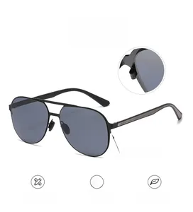 Detail of aviator sunglasses showing the ball-joint hinge and durable metal frame