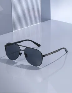 Close-up of black metal aviator sunglasses with silver trim on sleek modern display