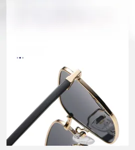 Detail of high-quality metal hinge and gold frame on polarized sunglasses for men