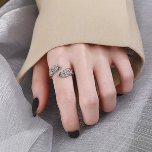 Minimalist silver-tone feather wing open ring for women with textured engraving details