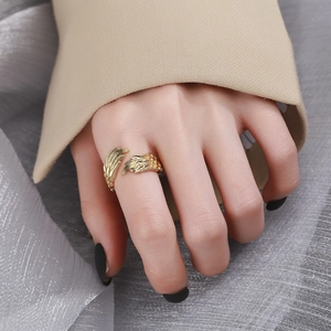 Elegant gold feather zircon ring for women with adjustable open design shown on hand