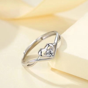 Elegant hollow double heart ring with zircon stone inlay and twisted band for women