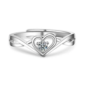 Detailed view of hollow heart ring with round zircon center and silver band cross texture