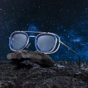 Retro luxury oval sunglasses with silver double bridge and blue frame on dark rock