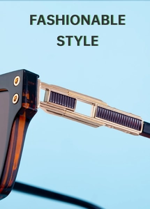 Détail des lunettes de soleil polarisées avec monture écaille ambre et charnières dorées