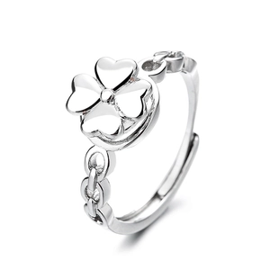 Adjustable silver spinning clover ring with heart-shaped leaves on a clean white background
