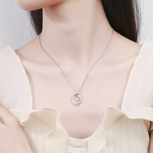 S925 silver sun and moon necklace with zircon stones worn by a female model