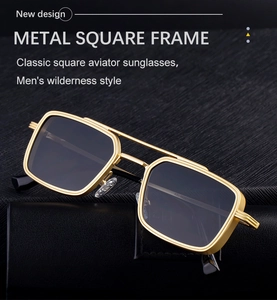 Detail of square gold metal sunglasses frames with dual bridge steampunk design
