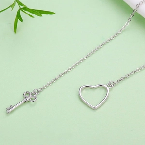 Macro detail of S925 sterling silver stamp on the heart and key pendant necklace
