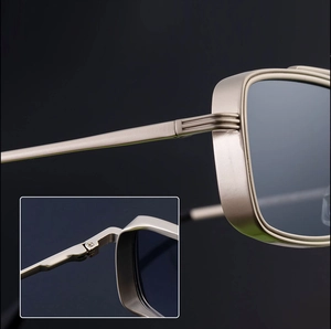 Close-up of the champagne gold metallic frame and stable hinge structure of square sunglasses