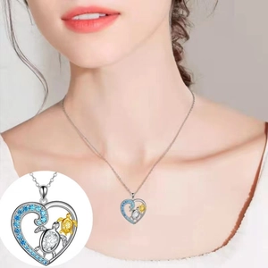 Women's heart turtle pendant necklace with blue zircon and dual sea turtle design