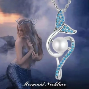 Detail of silver mermaid tail necklace with a large white pearl and blue accents
