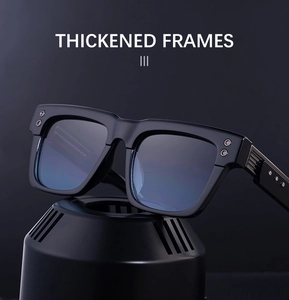 Detailed macro view of black square sunglasses with blue coating and metal rivets on base