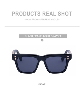 Front view of square black sunglasses with gold rivets and grey lenses