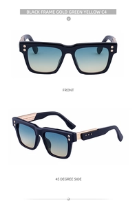 Detail view of square black sunglasses with gold metal hinges and green-yellow gradient lenses