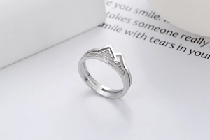Detailed close-up of a silver ring featuring a mountain design with sparkling zircon stones
