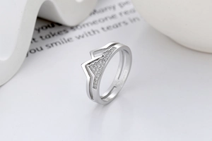Macro detail of silver mountain range ring with pavé cubic zirconia accents
