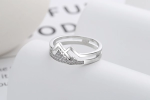 Detailed macro shot of a silver S925 ring featuring a mountain peak design with zircon stones