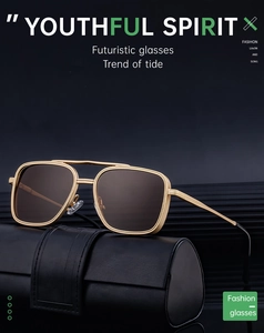 Detail of square gold metal sunglasses with double bridge and leather folding case