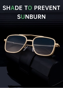 Macro detail of retro gold metal temples and gradient lenses on stylish full-rim sunglasses