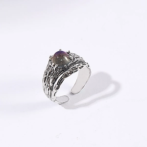 Vintage silver moonstone ring with textured metal band and iridescent oval gemstone