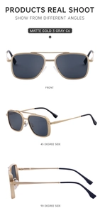 Detail view of matte gold pilot sunglasses with grey lenses and adjustable nose pads