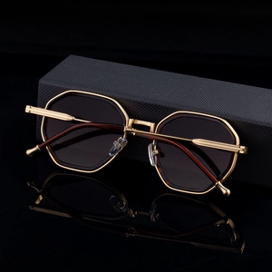 Polygonal sunglasses with gold metal temples and a grey textured hardshell case