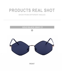 Detailed front view of geometric hexagonal sunglasses in gold and black metal frame