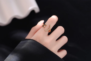 Detail of 18K gold open ring with double-layered design and sparkling pave zirconia