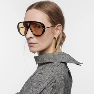 Side view of vintage aviator sunglasses with yellow lenses and gold metal temples