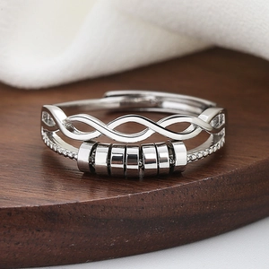 Polished silver rotating geometric anxiety ring with spinning beads for women